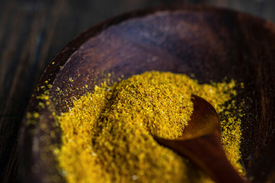 Georgian Chmeli Suneli spice blend in wooden bowl with spoon