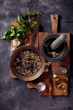 Italian pesto sauce ingredients with fresh basil and toasted pine nuts