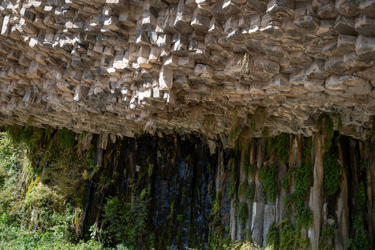 Basalt Rock Overhang and Green Vegetation at the Symphony of Stones, Garni, Armenia.