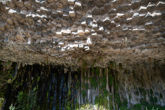 Basalt Rock Overhang and Green Vegetation at the Symphony of Stones, Garni, Armenia.