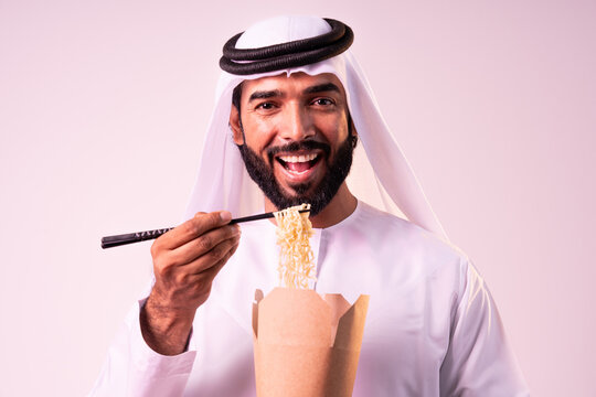 Arab businessman wearing emirati kandura portrait in studio