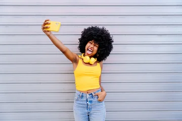 Beautiful young black woman outdoors in the city © oneinchpunch