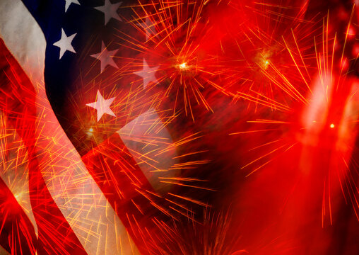 Close-up of American flags and fireworks