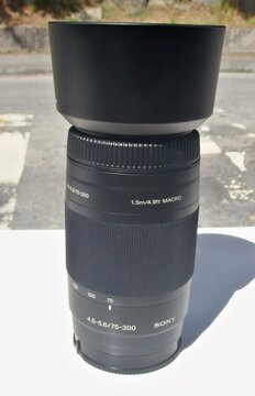 Sony 75-300mm telephoto zoom lens with hood
