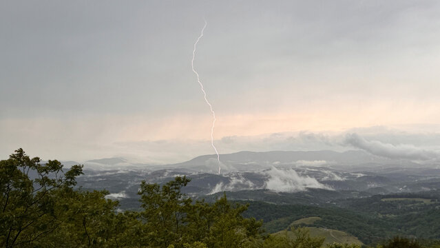 Lightning on sky over mountains