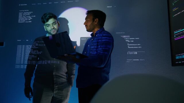 Male LLM Engineer Sharing Technical Knowledge About Generative AI Integration and Discussing Application with Colleague. Software Engineers Discussing Programming Code and Collaborating Concept.