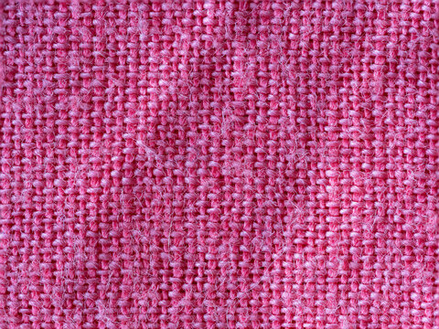 Textured detail of pink cotton fabric