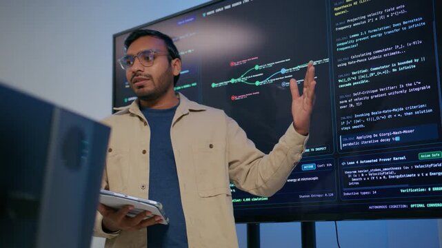 Professional Indian Software Engineer Presenting and Explaining Software Deployment Generative Artificial Intelligence Application Development to Colleagues During Professional Technical Meeting.