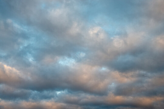 White puffy clouds in sunlight