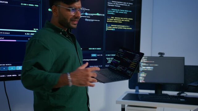 Professional Indian Software Engineer Presenting and Explaining Software Deployment Generative Artificial Intelligence Application Development to Colleagues During Professional Technical Meeting.