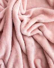 Soft pink plush fleece blanket background, cozy textile fabric texture © MariiaDemchenko
