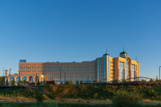 Gazprom Transgaz Ukhta office building across a grassy urban foreground