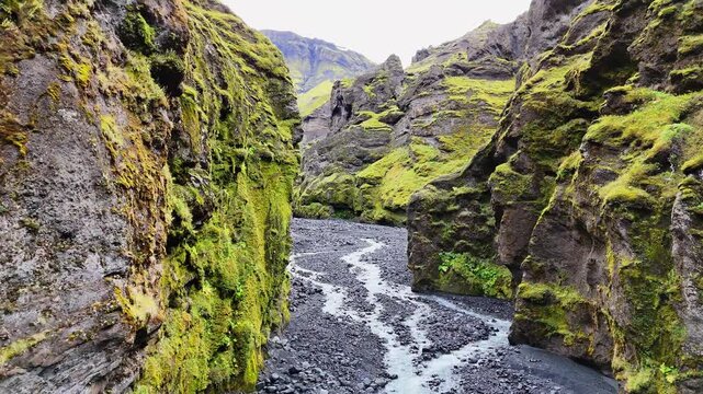 Low aerial view across the river bed in the Stakkholtsgj&aacute; Canyon in the &THORN;&oacute;rsm&ouml;rk (Thorsmork) nature reserve in the southern highlands of Iceland, September 2026.