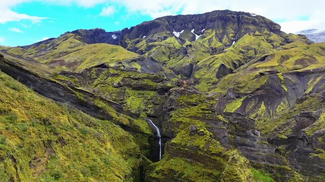 Aerial view of the Stakkholtsgj&aacute; Canyon and then panning down on a waterfall in the &THORN;&oacute;rsm&ouml;rk (Thorsmork) nature reserve in the southern highlands of Iceland, September 2026.