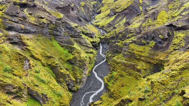 Slow drone flight over a stream in the upper reaches of the Stakkholtsgj&aacute; Canyon in the &THORN;&oacute;rsm&ouml;rk (Thorsmork) nature reserve in the southern highlands of Iceland, September 2026.