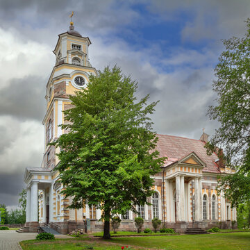 Side view of Lutheran church in Aluksne, Latvia. Daytime shot showcasing historic classicist architecture