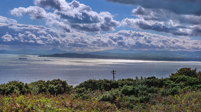 Panoramic view of Dublin Bay from Howth Head, Ireland. Daytime shot showcasing scenic coastal landscape