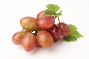 Fototapeta premium Bunch of fresh ripe grapes with green leaves on white background