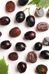 Fototapeta premium Fresh ripe grapes on white background, flat lay