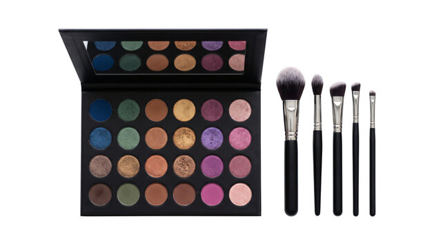 Eyeshadow palette and makeup brush set rest on black background.