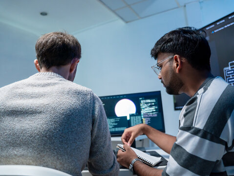 Software engineering use computer working develop AI office are assisting algorithm systems or verifying code. Programmer teamwork using artificial intelligence on laptop analysis or writing coding