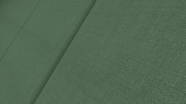 Modern Cinematic Movement Along Italian Sage Green Twill Wool Fabric with Angled Camera Perspective, Gentle Lighting and Distinctive Diagonal Weave