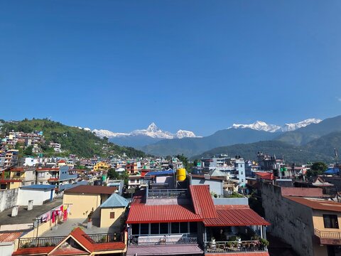 Panoramic view of Pokhara, Nepal, with the iconic Machapuchare (Fishtail) mountain peak visible in the Annapurna Himalayan range in the background
