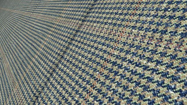 Distinctive Cinematic Movement Along Italian Glen Plaid Houndstooth Wool Linen Silk Fabric with Angled Camera View, Refined Lighting and Intricate Patterns