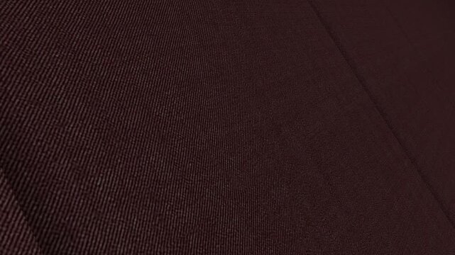 Vivid Cinematic Movement Along Italian Burgundy Wine Twill Stretch Wool Fabric with Angled Perspective, Rich Lighting and Detailed Diagonal Weave Patterns