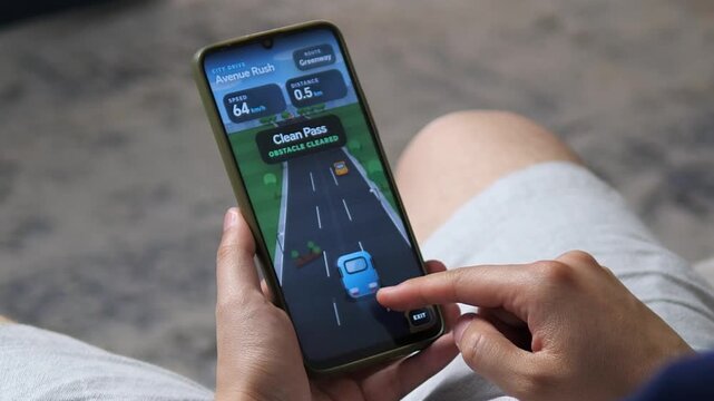 Mobile driving game challenges a player to steer through city traffic and avoid road obstacles, highlighting casual gaming, quick reactions and interactive smartphone entertainment.
