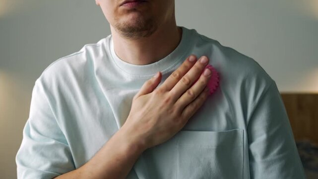 Man Performing Self-Massage with Therapy Ball to Relieve Arm and Shoulder Tension