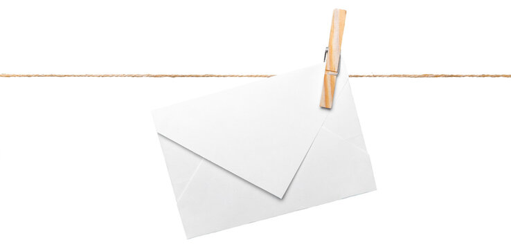 Envelope pinned to a string with a clothespin against a white background