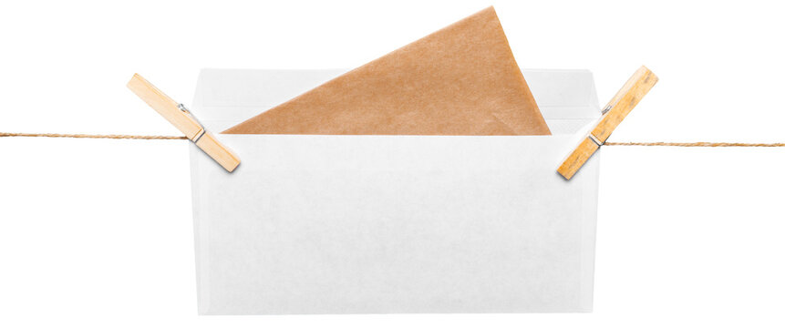 Envelope with a brown letter resting on a white background held by two wooden clips on a string