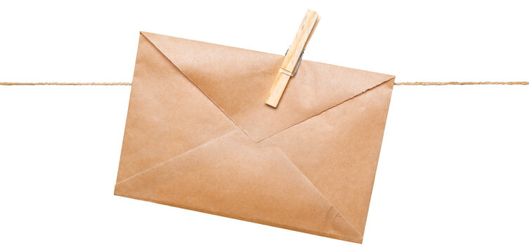 Envelope hanging on a string with a clothespin in a simple setting