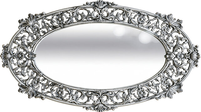 Isolated ornate oval mirror with intricate antique silver decorative frame in baroque rococo style