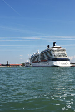 Venice, Italy - Sept 21, 2014: The luxury cruise ship Celebrity Silhouette and another cruise ship moored in the Venetian port at morning. More than 10 million tourists visit Venice every year