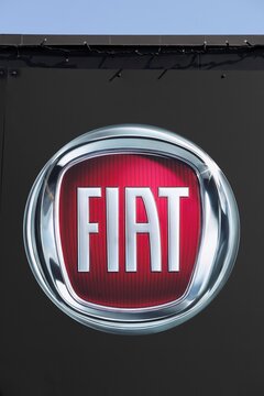 Aarhus, Denmark - April 18, 2021: Fiat logo on a wall. Fiat Chrysler Automobiles is an Italian-American corporation and currently the world&rsquo;s eighth largest automaker