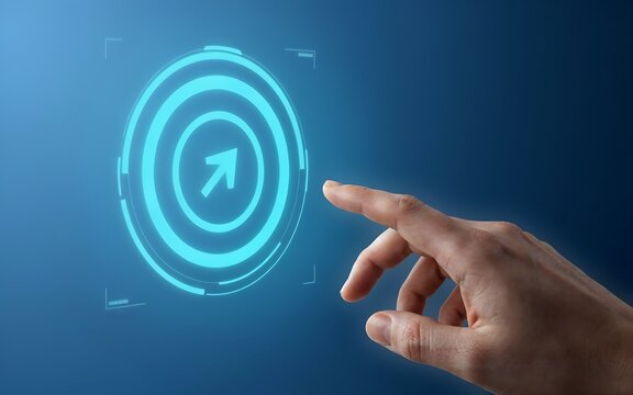 Human finger touching a glowing blue digital target icon on a