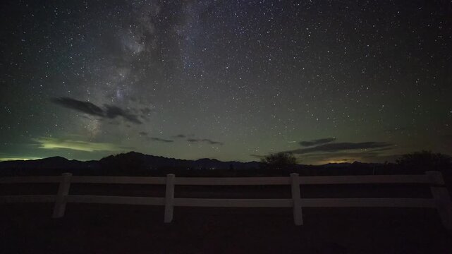 Time lapse of Milky Way stars and thin clouds over a ranch in the southwest