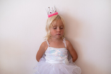 :Little Blonde Girl in Princess Crown and Dress Sleeping Standing Up  © RealPeopleStudio