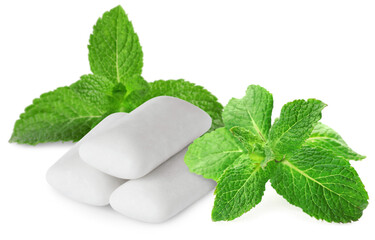 Menthol chewing gum pieces and green mint leaves isolated on white © New Africa