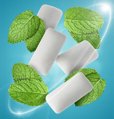 Menthol chewing gum pieces and mint leaves in air against blue background © New Africa