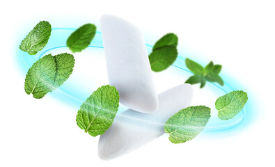 Menthol chewing gum pieces and mint leaves in air against white background © New Africa