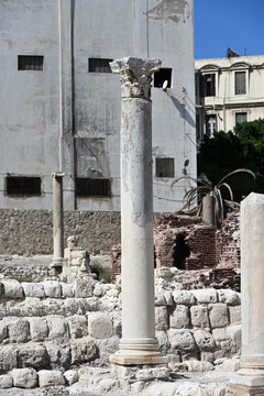 Freestanding Reconstructed Corinthian Order Column with Contemporary City Backdrop, Alexandria, Egypt