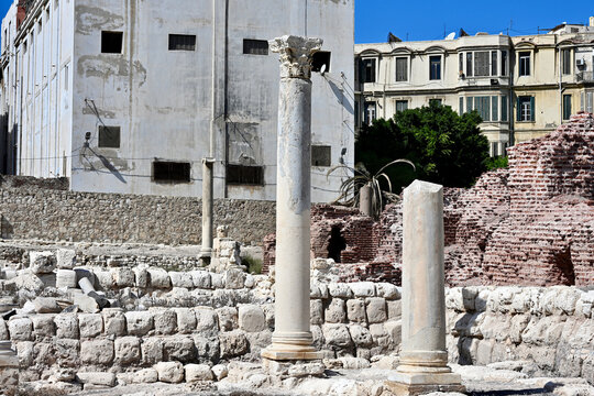 One Broken and One Reconstructed Column with Contemporary City Backdrop in Alexandria, Egypt