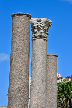 Three Ancient Granite Columns, Center Column in Focus with Corinthian Capital, Alexandria, Egypt