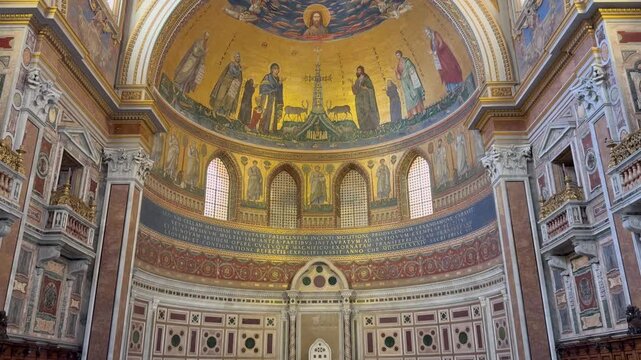 Cathedra of the Pope and apse mosaic inside Archbasilica of Saint John Lateran in Rome, Italy