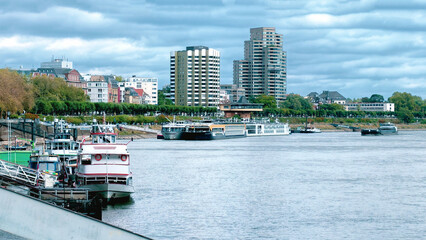 Moored Boats Beside Urban River Waterfront © YuliiaMazurkevych