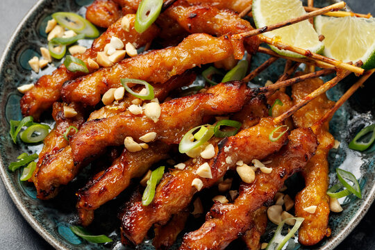 Grilled Chicken Satay Skewers with Peanuts, Spring Onions and Lime