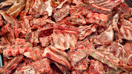 Hearty raw pork spine segments and rib cuts prepared for simmering rich flavor broth © ice on earth